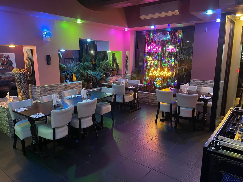 Dining tables and lounge seating inside Wazobia